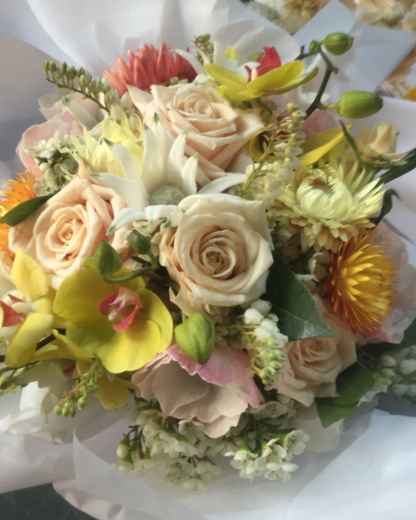 cream and yellow floral cocktail round arrangement