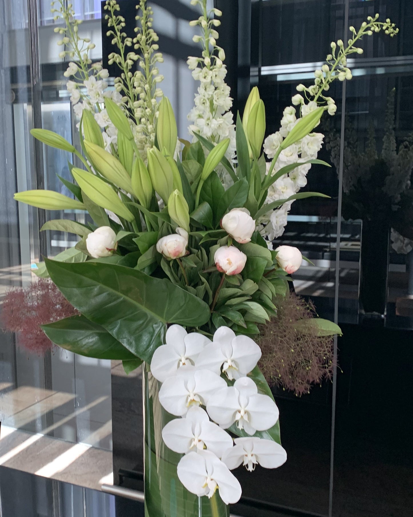 Tall vase with flowers - white orchards soft pink peonies and lilies